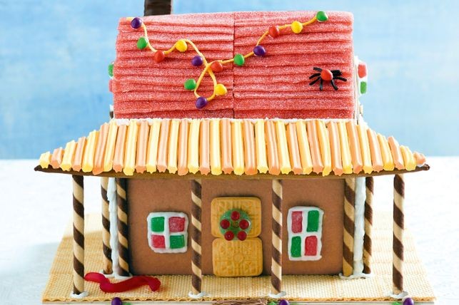 gingerbread store with candy tape roof and lights.