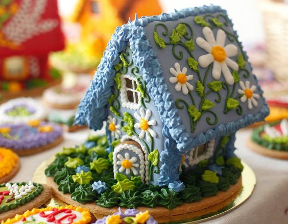 blue frosting floral themes gingerbread house.