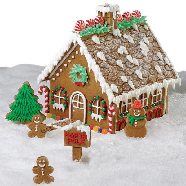 frosting icicles with powdered sugar snow gingerbread house.