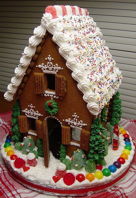 large gingerbread house with stylish frosting.
