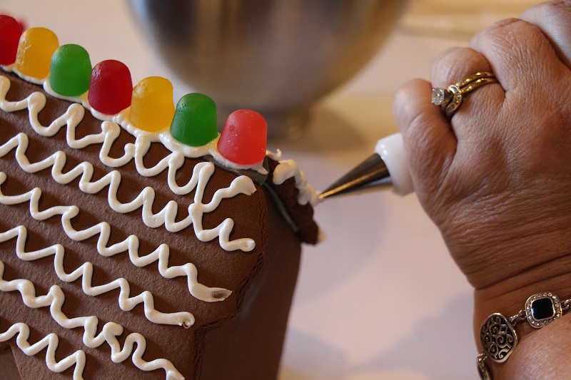 adding candy and frosting to kit