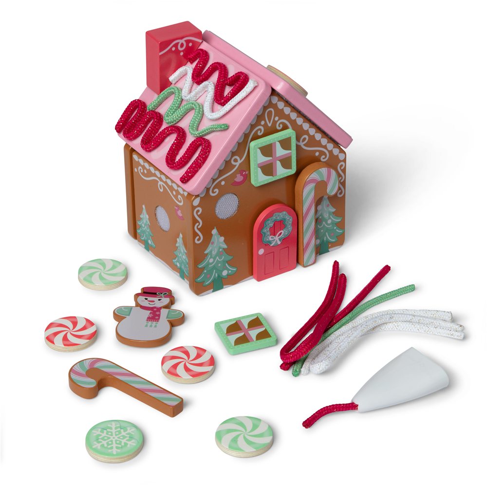 Melissa and Doug classic wooden gingerbread house with its loose wooden peppermints, candy cane, snowman, window, icing cords and white icing pen